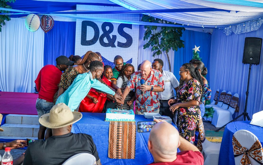 Davis & Shirtliff staff and the Group Chairman, Alec Davis, cutting cake during christmas celebration Davis & Shirtliff staff and the Group Chairman, cutting cake during christmas celebration